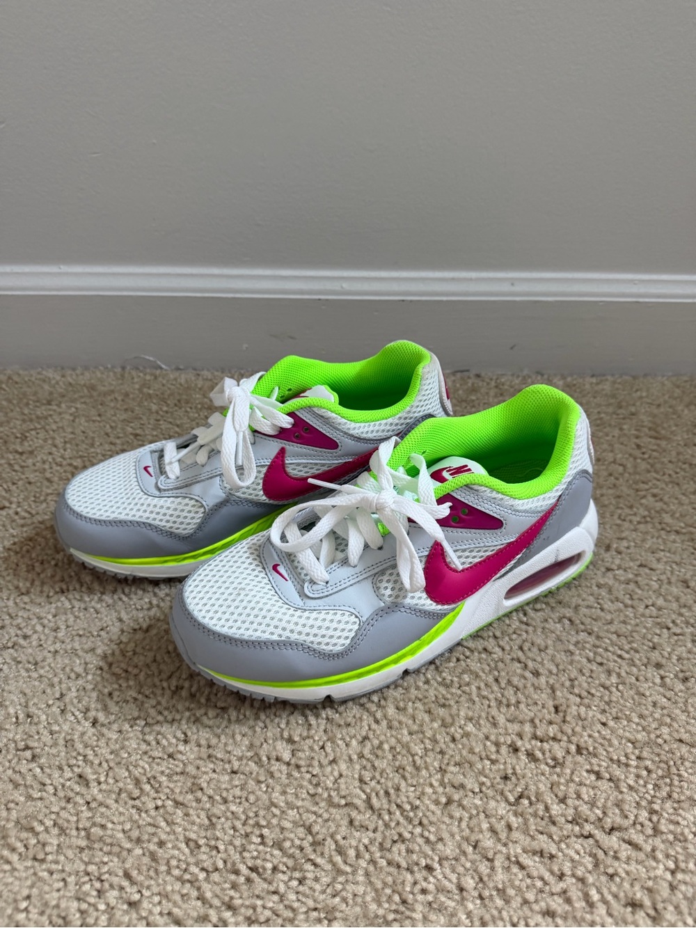 Nike Kids White Sneakers with Pink Swoosh and Neon Green Lining